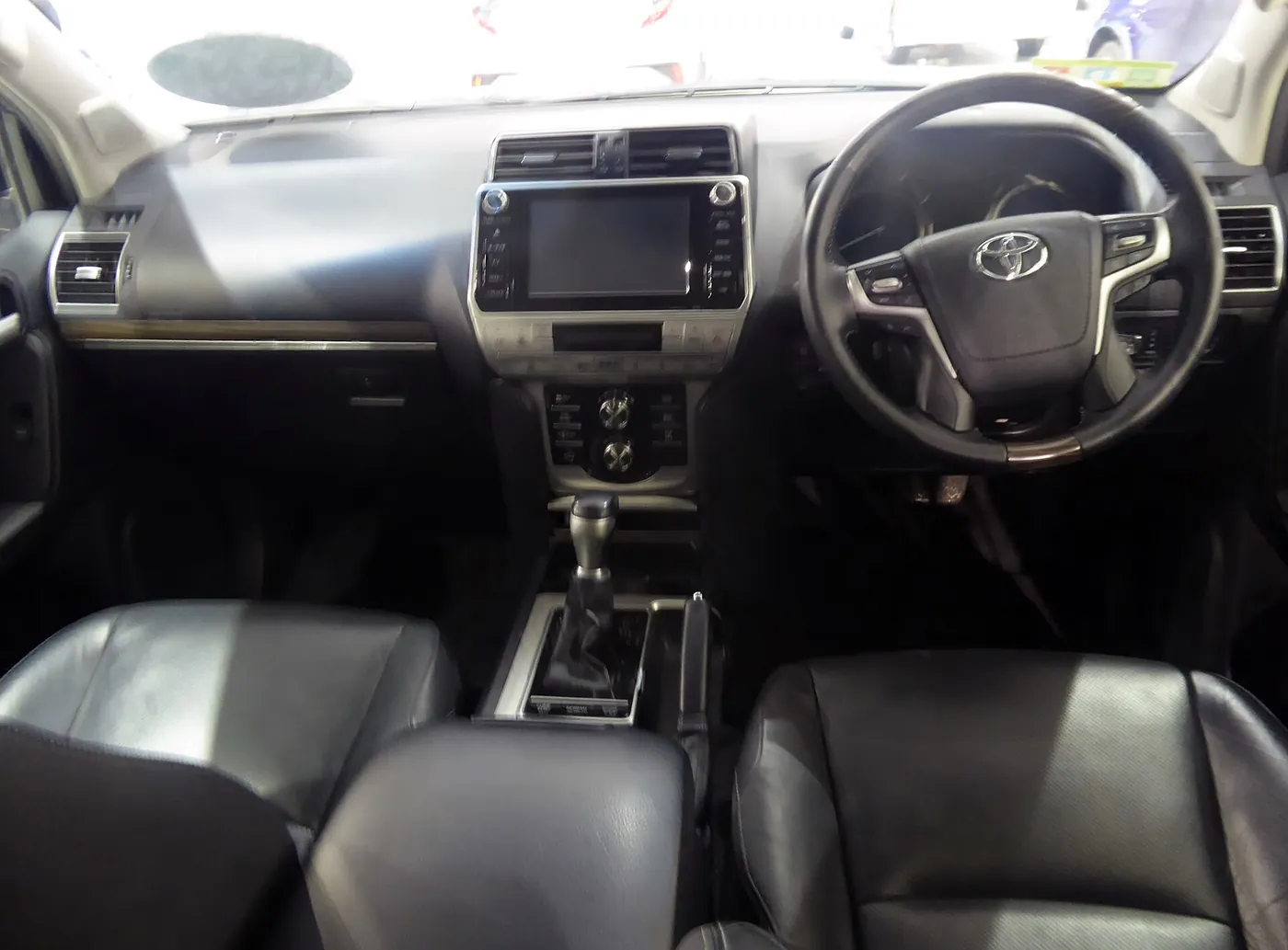 Inside a Toyota Land Cruiser Prado — dashboard and seating