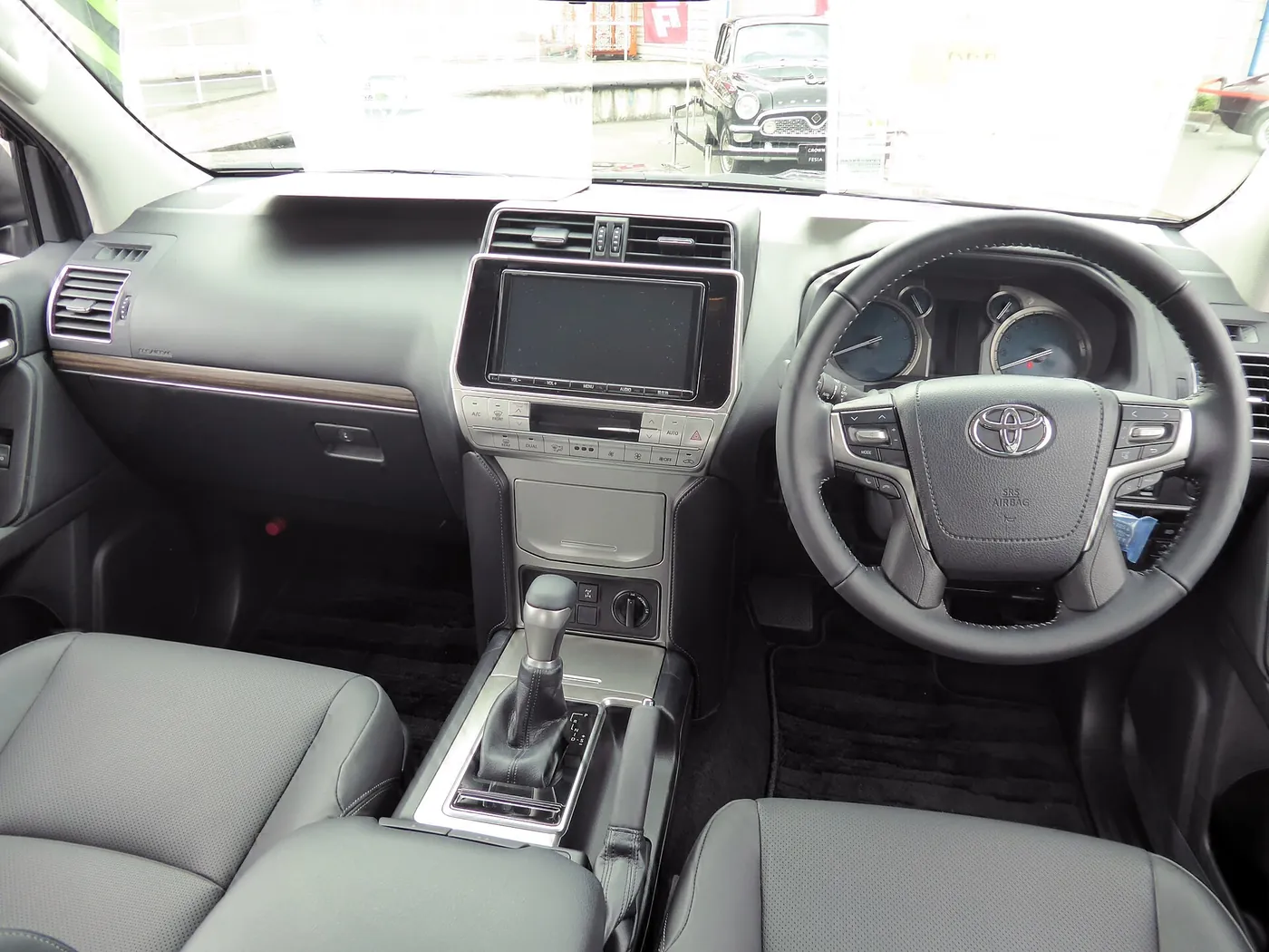 Inside a Toyota Land Cruiser Prado — dashboard and seating